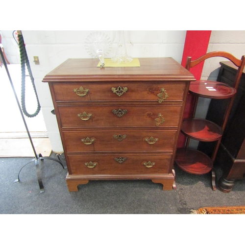 1077 - A Georgian mahogany slim chest of four drawers on bracket feet, handles loose, 83cm x 74cm x 43cm