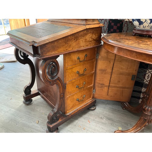 1083 - A Victorian walnut Davenport desk, slope top opening to reveal satinwood interior, side cabinet open... 