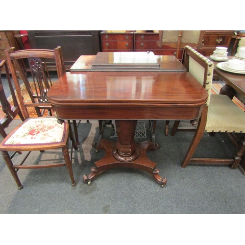 1090 - A late Regency mahogany folding tea table on flared hexagonal column and concave rectangular plateau