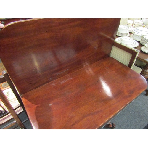 1090 - A late Regency mahogany folding tea table on flared hexagonal column and concave rectangular plateau