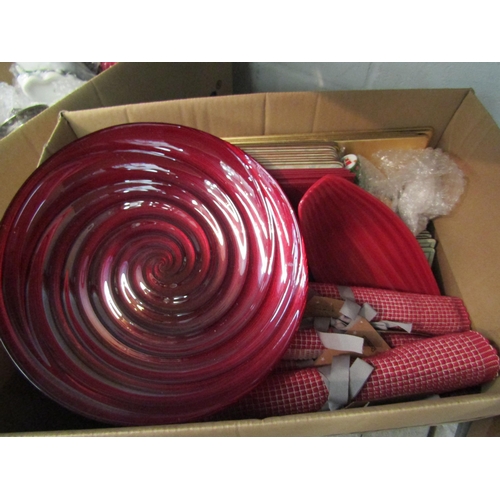 1200 - A box of miscellaneous place mats, red ceramic and glass dishes together with a box of miscellaneous... 