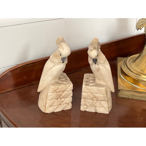 1243 - A pair of alabaster cockatoo bookends, each 13cm tall