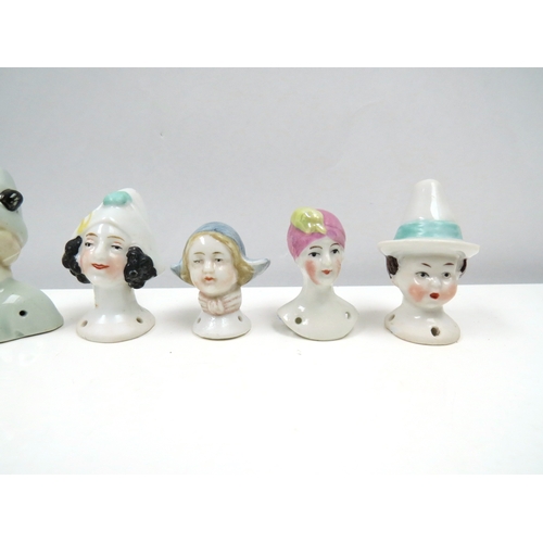 1281 - Eight glazed china heads including Pierrette