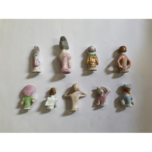 1283 - Nine early 20th Century glazed china pin cushion dolls    (R) £40