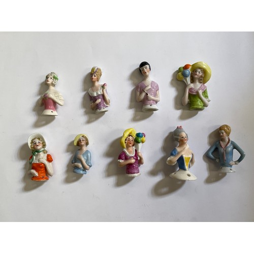 1284 - Nine glazed china half dolls and pin cushions, including balloon holding, tallest 6cm.   (R) £40