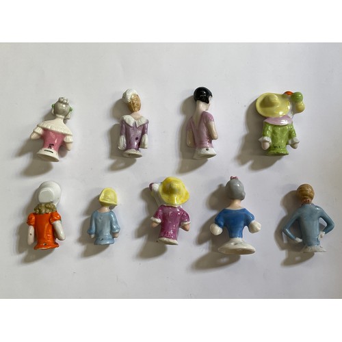 1284 - Nine glazed china half dolls and pin cushions, including balloon holding, tallest 6cm.   (R) £40