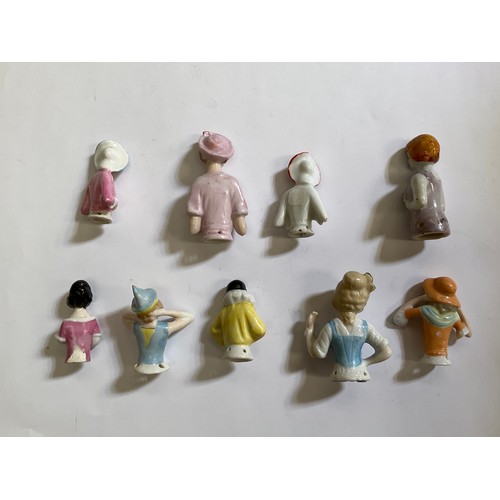 1285 - Nine glazed china half dolls and pin cushions including Pierrette, tallest 6.5cm   (R) £40