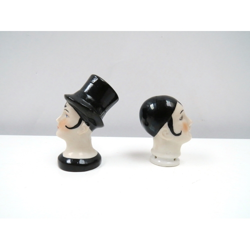 1315 - Two porcelain female cushion heads, lady wearing top hat and pierrette 6cm & 5cm tall   (R) £20