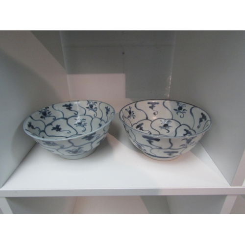 1343 - A pair of Tek Sing Treasure blue and white bowls from Nagel Auctions. Approximately 15cm diameter