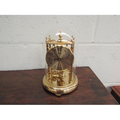 1023 - A modern brass and glass table lamp, a Kuma anniversary clock and twin light lamp (3)    (E) £10-15