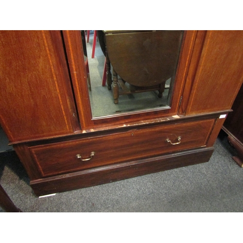 1041 - An Edwardian mirrored door wardrobe with under drawer. 201cm x 128cm x 49cm    (R) £30