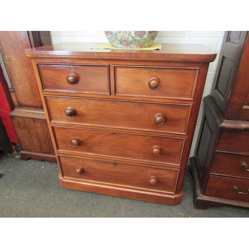 1060 - A Victorian mahogany chest of two over three drawers with rounded corners and bun handles, 112cm x 1... 