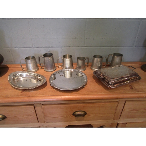 1071 - A quantity of silver plate serving dishes including lidded entree dish and six tankards including Se... 