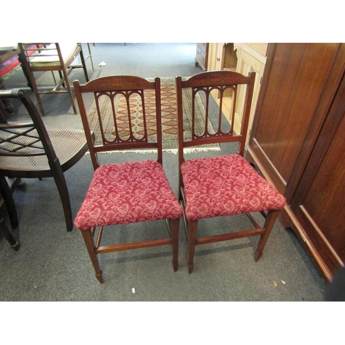 1085 - A pair of Edwardian inlaid mahogany bedroom chairs