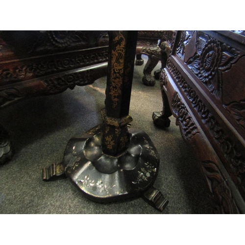 1128 - A 19th Century black lacquered gaming table with chequerboard top, faceted support, shaped plateau b... 