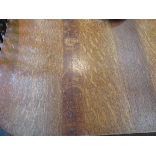 1139 - A late 19th/early 20th Century oak extending dining table with four extra leaves. Approx. 12ft long