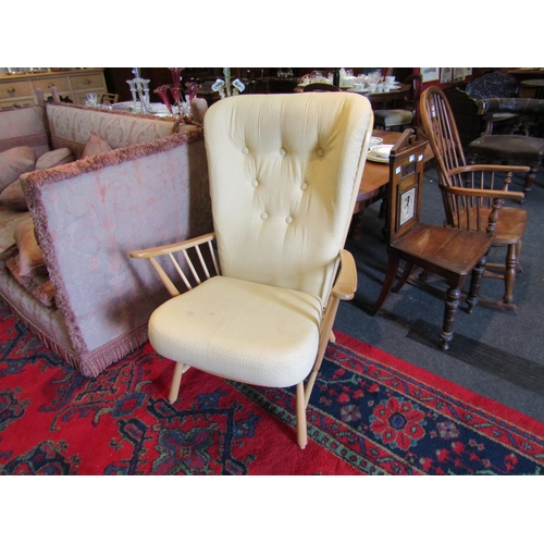 1146 - An Ercol light elm armchair