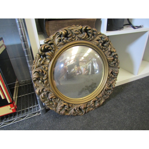 1236 - A gilt gesso convex wall mirror, 46cm diameter total