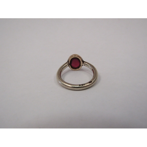 1262 - A 9ct gold ring set with a ruby