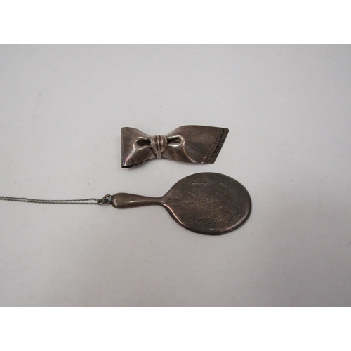 1290 - A sterling silver bow clip and miniature silver mirror on chain