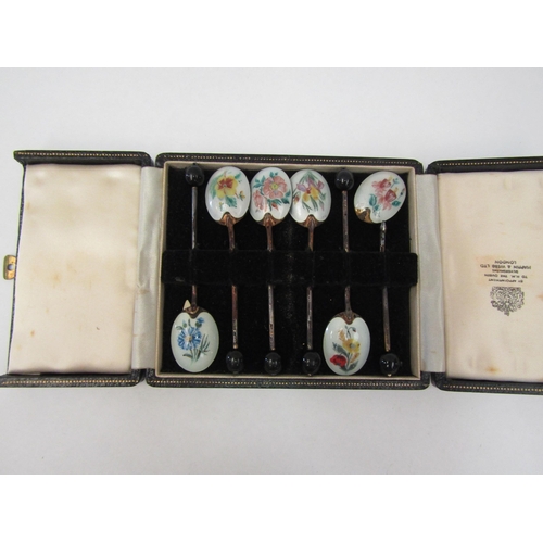 1295 - A set of six silver and guilloche teaspoons some damage present