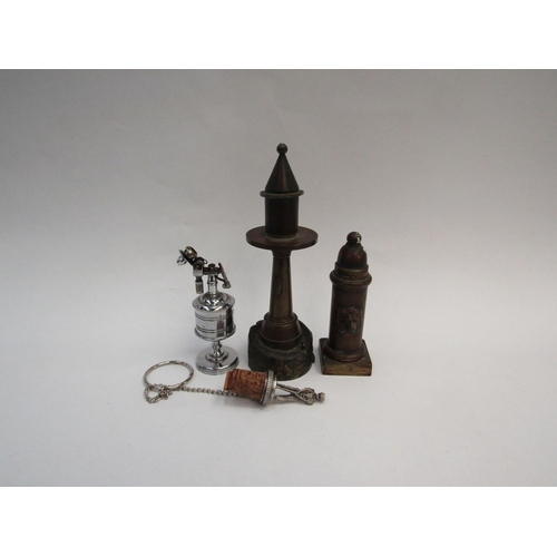 1314 - Two bronze table lighters, one as a lighthouse the other as a fire hydrant with lion mask detail, an... 