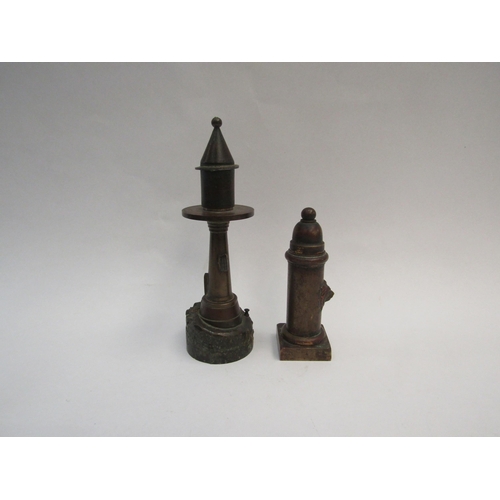 1314 - Two bronze table lighters, one as a lighthouse the other as a fire hydrant with lion mask detail, an... 