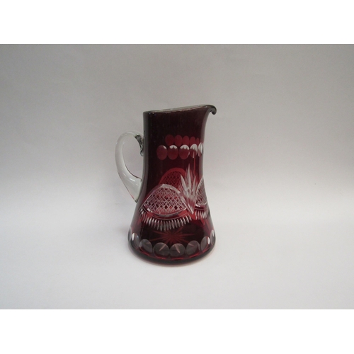 1319 - A cut glass ruby overlaid jug, 23cm tall   (E) £10-15