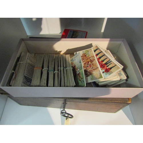 1342 - Cigarette cards loose and in album and a box containing vintage cards