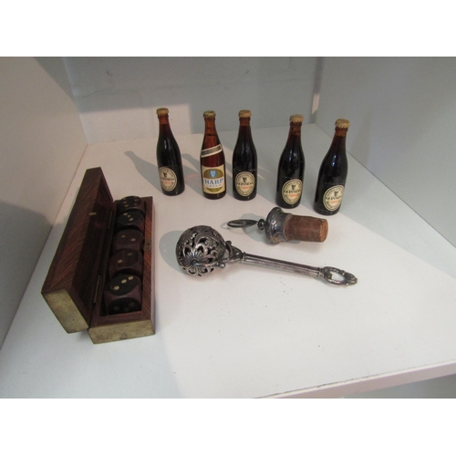 1346 - Five miniature display bottles, boxed set of five dice, rattle and bottle stopper