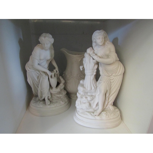 1356 - Two Parian figures of Grecian women and a jug decorated wtih water lilies (3)