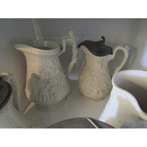 1362 - Five Victorian moulded jugs, thistle, fern, pineapple, etc