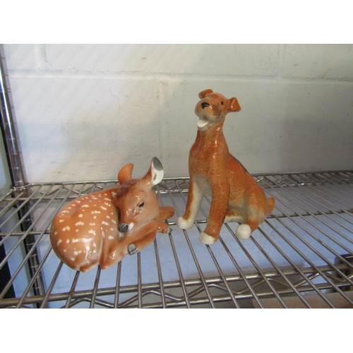 1377 - A USSR figure of a recumbent fawn and a USSR figure of a seated terrier (2)     (E) £10-15