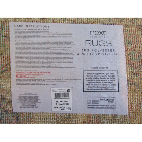 1488 - A Next polyester and polypropylene cream ground rug, 290cm x 200cm