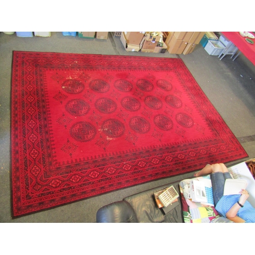 1490 - An Afghan wool carpet, three rows of central guls, multiple borders, 366cm x 275cm  (E)   £50-70