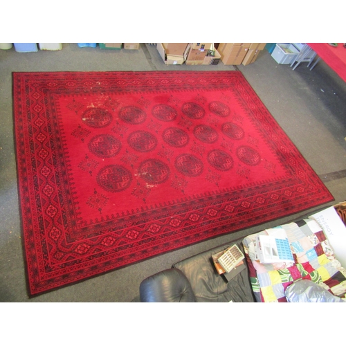 1490 - An Afghan wool carpet, three rows of central guls, multiple borders, 366cm x 275cm  (E)   £50-70