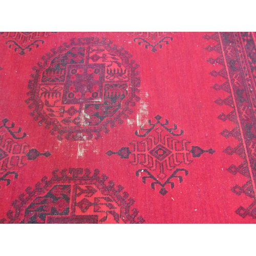 1490 - An Afghan wool carpet, three rows of central guls, multiple borders, 366cm x 275cm  (E)   £50-70