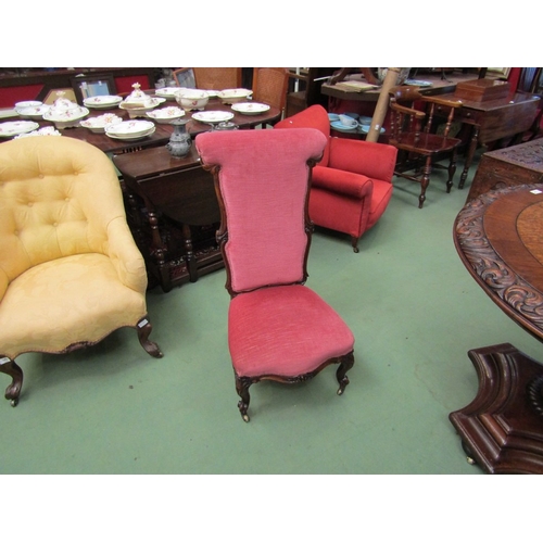 4063 - A Circa 1840 walnut bedroom chair having carved frame and fore legs on brass castors  (R) £35