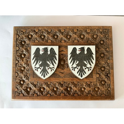 5451 - A carved oak plaque with two applied enamel on brass eagle shields, thought to be German   (R) £60