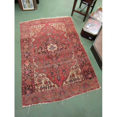 4004 - A wool floor rug, red ground, 142cm x 100cm a/f