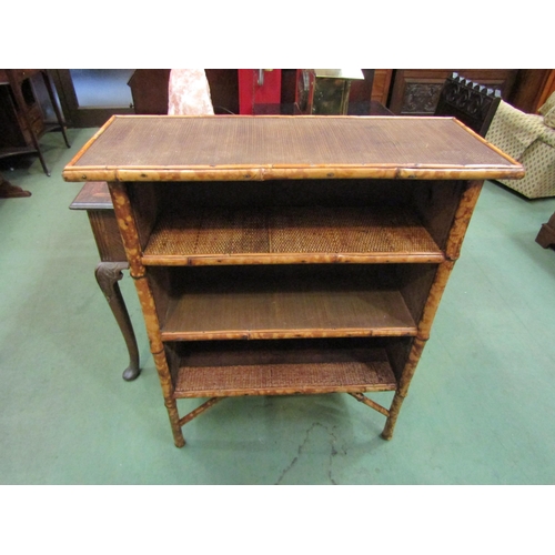 4095 - An early 20th Century bamboo three tier bookshelf. 90cm x 77cm x 30cm