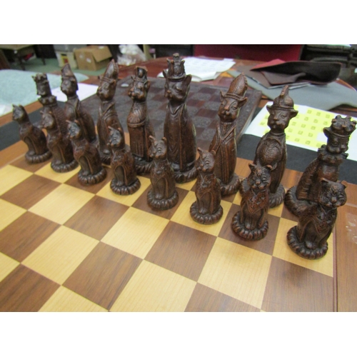 4100 - A Tudor rose chessboard and another chess set with Cheshire cat themed pieces