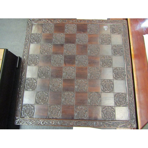 4100 - A Tudor rose chessboard and another chess set with Cheshire cat themed pieces