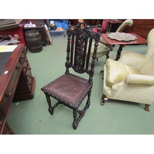 4102 - A Victorian Black Forest carved oak chair with turned and finial decoration