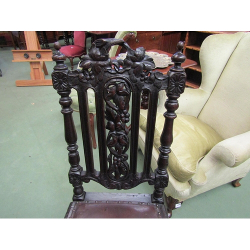 4102 - A Victorian Black Forest carved oak chair with turned and finial decoration