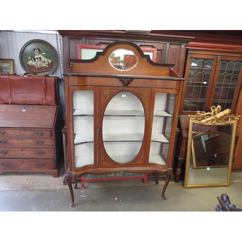 2069 - An Edwardian mahogany glazed display cabinet with shaped glass and hand painted floral sprays    (E)... 