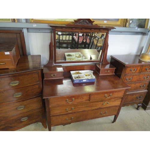 2077 - A 1930's mahogany dressing chest with bevelled mirror back