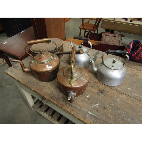 2004 - Two Victorian copper kettles, two aluminium Aga kettles and an iron pan