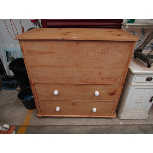 2042 - A Victorian stripped and waxed pine chest with lift top blanket section over two drawers, white porc... 