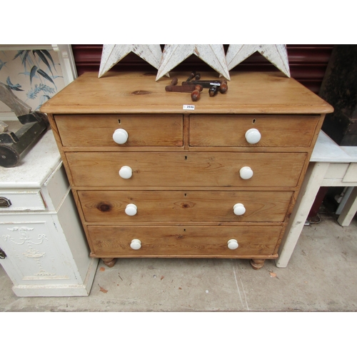 2046 - A Victorian strip and waxed pine two over three chest of drawers with white porcelain knobs